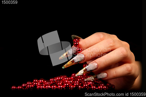 Image of Human fingers with long fingernail and beautiful manicure isolated on black