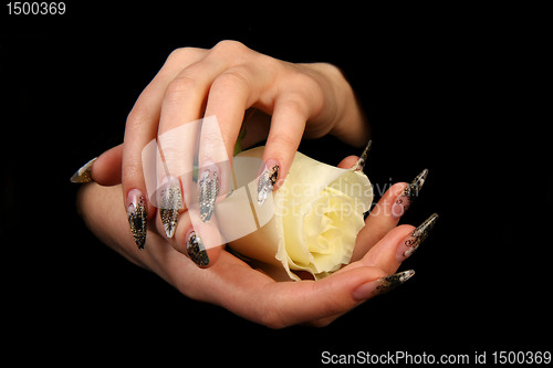 Image of Human fingers with long fingernail and beautiful manicure isolated on black