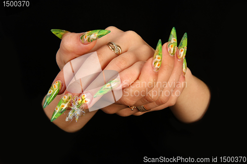 Image of Human fingers with long fingernail and beautiful manicure isolated on black