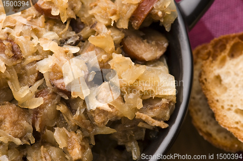Image of traditional polish sauerkraut (bigos) with mushrooms and plums f