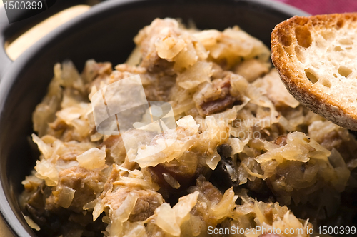 Image of traditional polish sauerkraut (bigos) with mushrooms and plums f