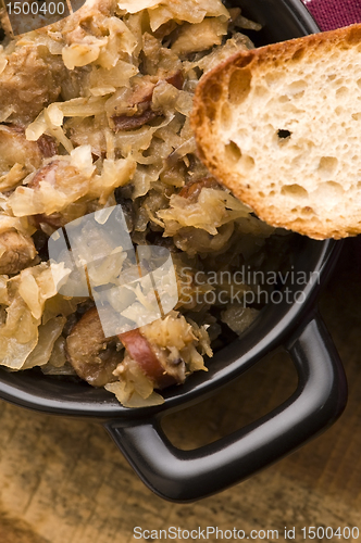 Image of traditional polish sauerkraut (bigos) with mushrooms and plums f
