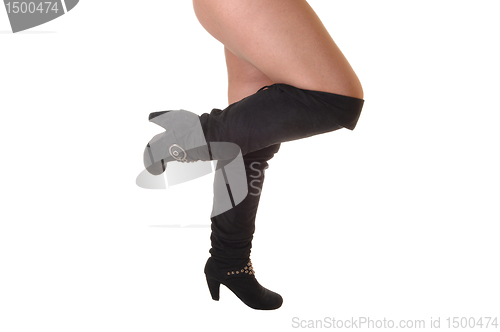 Image of Legs in black boots.