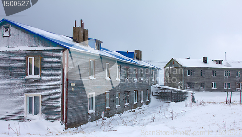 Image of Wooden cottage covered with snow