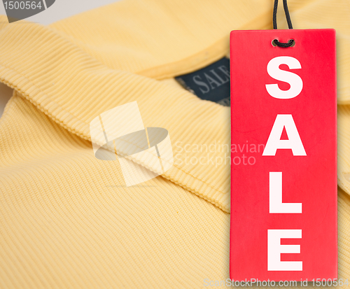 Image of Sale Tag and Polo Shirt