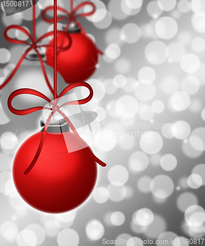 Image of Hanging Ornaments on Blurred Silver Background