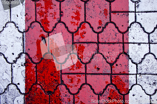 Image of Background of red crosswalk on road paved by tiles