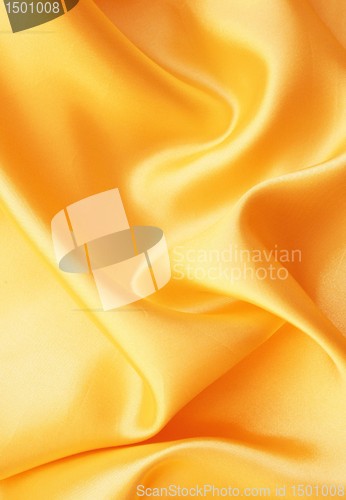 Image of Smooth elegant golden satin as background 