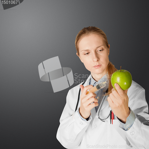 Image of scientist woman with apple