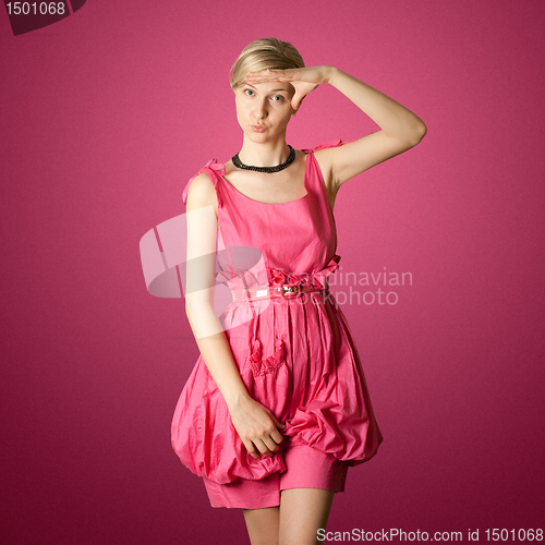 Image of sexy female stewardess in pink