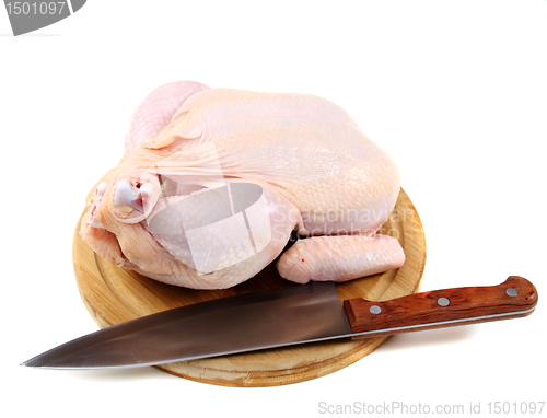 Image of Uncooked chicken on a cutting board.