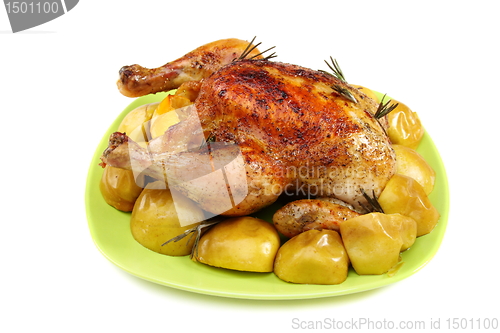 Image of Chicken stuffed with lemons, apples and rosemary.