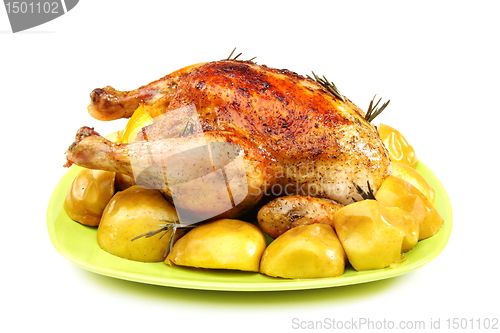Image of Chicken stuffed with lemons, apples and rosemary.
