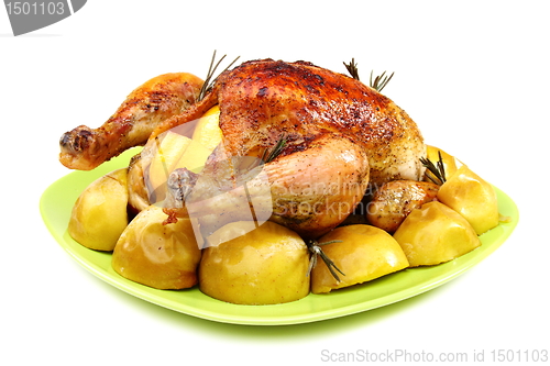 Image of Chicken stuffed with lemons, apples and rosemary.
