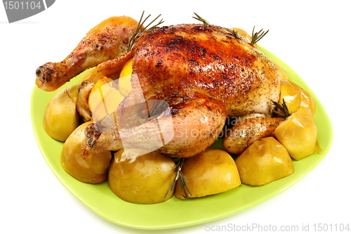 Image of Chicken stuffed with lemons, apples and rosemary.