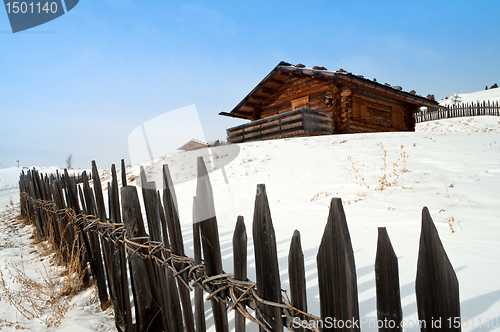 Image of Old winter cottage with fence