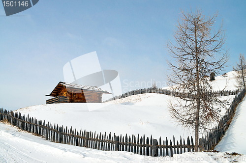 Image of Old winter cottage with fence