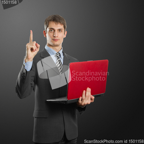 Image of male in suit with laptop with idea