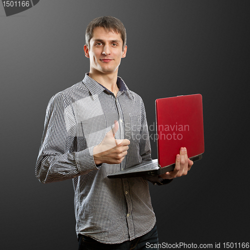 Image of male with laptop in his hands well done