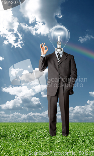 Image of businessman with lamp-head holding blank card outdoors