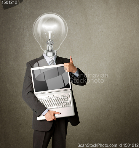 Image of businessman with lamp-head with open laptop shows welldone