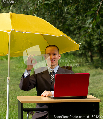 Image of businessman with umbrella
