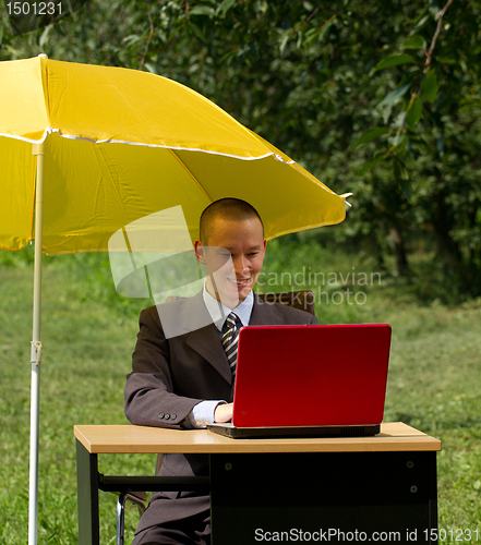 Image of businessman with umbrella
