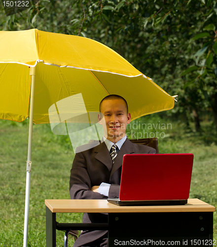 Image of businessman with umbrella