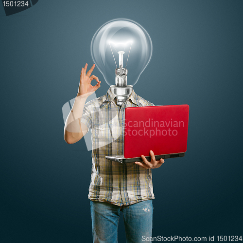 Image of casual lamp-head with laptop shows OK