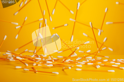 Image of many yellow cotton sticks