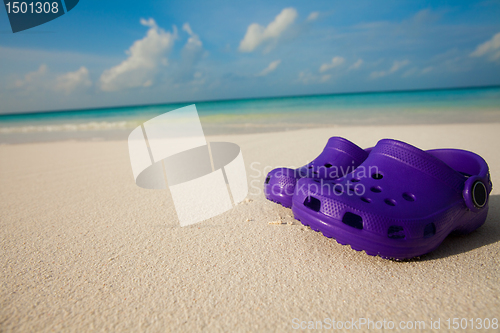 Image of Kids shoes on the beach