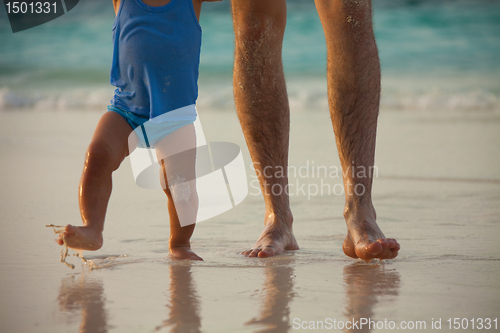 Image of Father and kid's legs