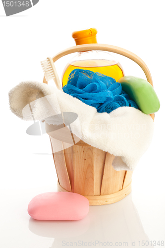 Image of bucket with towel, soap, showering gel and mop