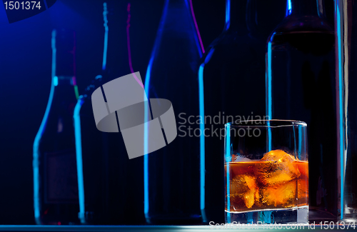 Image of Whiskey with ice in the good bar