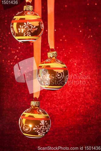 Image of Three Christmas balls on red