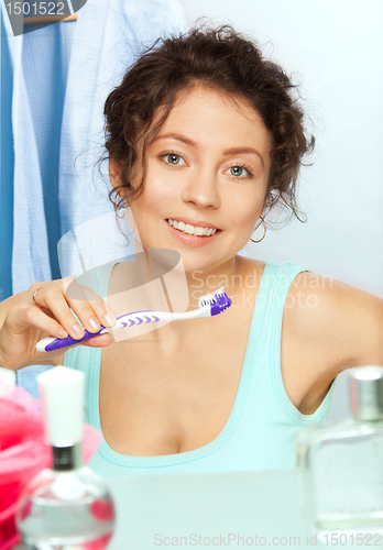 Image of Toothbrush and smiling woman