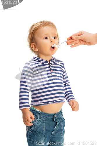 Image of Cute toddler eat from spoon