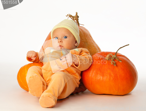 Image of Baby with pumpkins