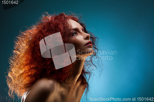 Image of Portrait of a curly red hair woman