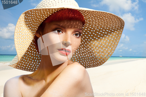 Image of Beautiful woman in straw hat