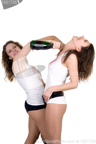 Image of Two girls pour on each other red champagne