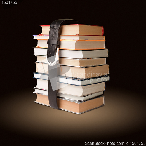 Image of books pile with belt