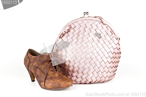 Image of Pink bag with a shoe.