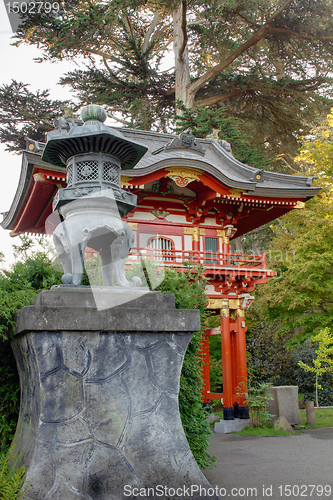 Image of Bronze Lantern by Pagoda in Japanese Garden