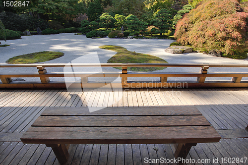 Image of View of Japanese Sand Garden from Wooden Bench
