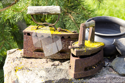 Image of Ancient metal rusty mossy iron tool vintage object