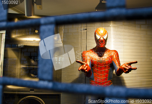 Image of Spiderman. Hero helping people in trouble.