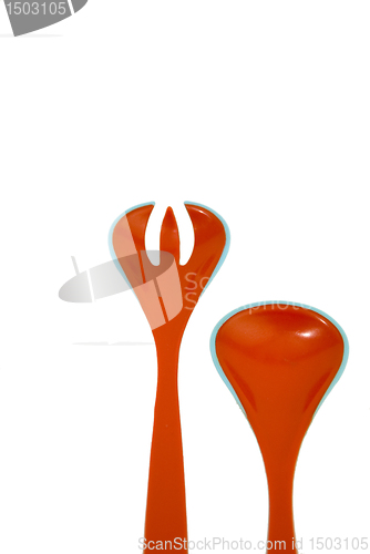 Image of Two red plastic tools 