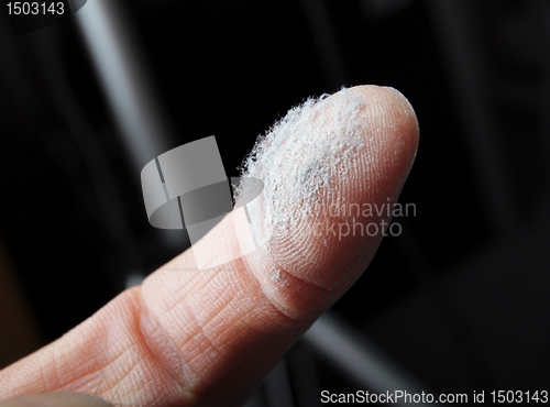 Image of dust and finger