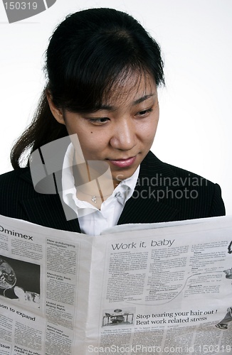 Image of Asian businesswoman reading